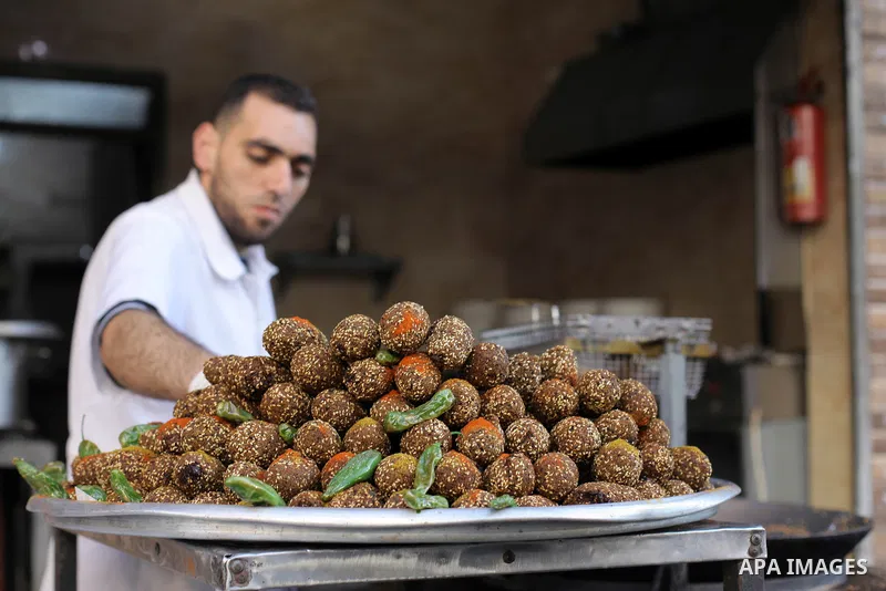 A Palestinian vendor prepares traditional chickpeas known as "Falafel" for breakfasting on the Muslim holy fasting month of Ramadan in Gaza city on April 29, 2020. Muslims around the world celebrate the holy month of Ram...