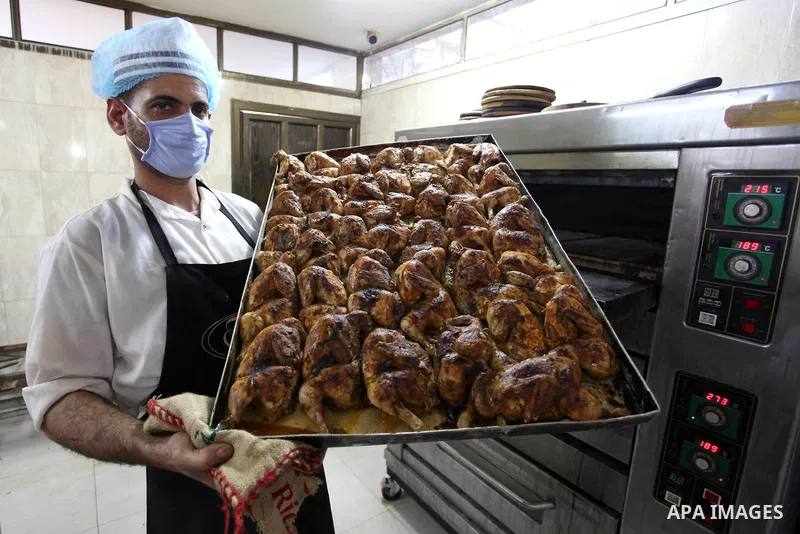 Palestinian chefs wearing protective masks, prepare meals for breakfast on holy fasting month of Ramadan for people who were quarantined, as a precaution against the spread of the coronavirus disease (COVID-19), at a res...