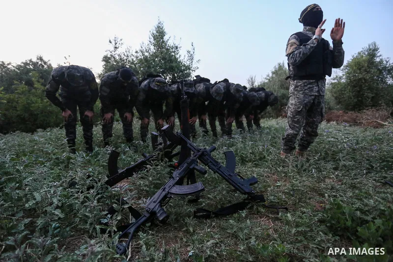 Palestinian militants from the Al-Quds Brigades, the armed wing of the Islamic Jihad movement pray at the border in the east of Gaza city on the Muslim holy fasting month of Ramadan on May 3, 2020. Muslims around the wor...