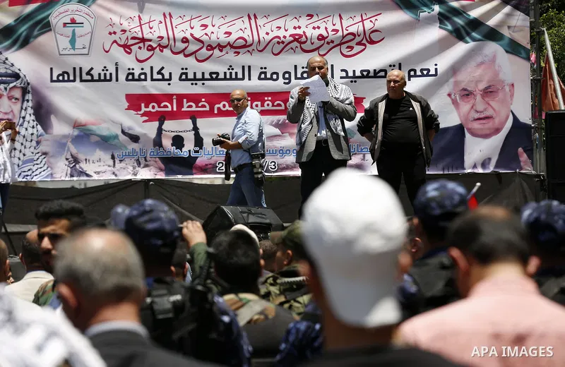 Palestinians take part in a protest against a US-brokered peace proposal in the West Bank city of Nablus, on June 3, 2020. The plan, launched by US President Donald Trump, proposes granting Israel several of its key long...