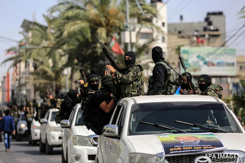 Palestinian militants from the Al-Quds Brigades, the armed wing of the Islamic Jihad movement, take part in a symbolic funeral for the movement's former leader Ramadan Shalah in Gaza city, on June 7, 2020. Ramadan Abdull...