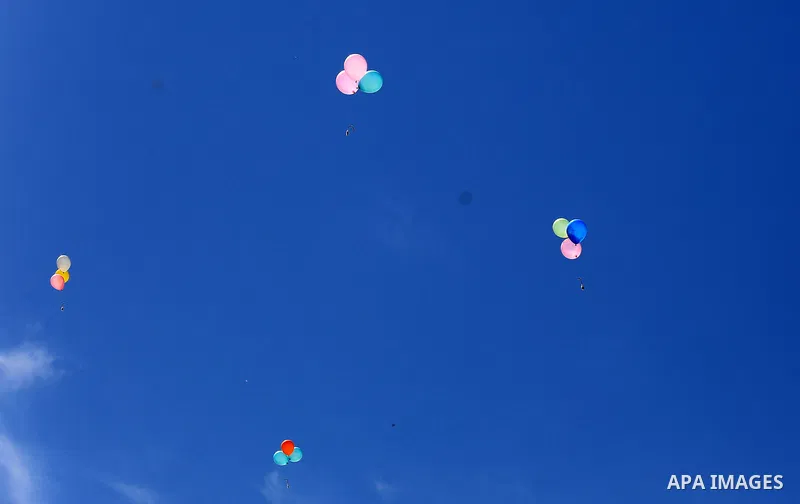 Palestinians prepare balloons attached with flammable materials at the Israel-Gaza border, in al-Bureij refugee camp in the center of Gaza Strip on June 12, 2020. Photo by Ashraf Amra