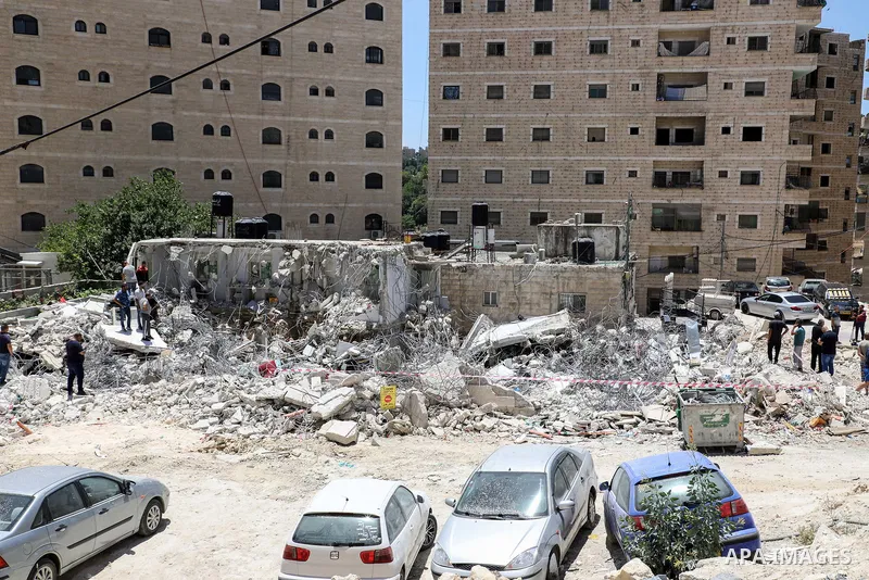 Israeli bulldozers demolish a Palestinian house which does not have the Israeli needed permits in the Shuafat refugee camp in east Jerusalem, on June 15, 2020. Photo by Muhammed Qarout Idkaidek