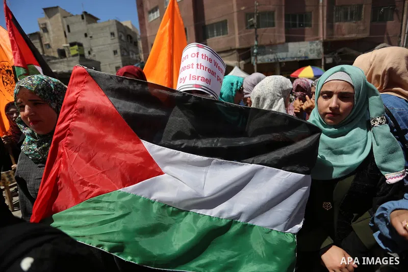 Palestinian protesters demonstrate against Israel's plans to annex parts of the occupied West Bank, in Khan Younis in the southern of Gaza strip on June 23, 2020. Photo by Ashraf Amra