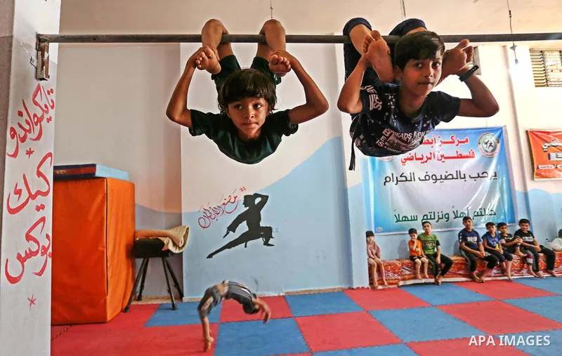 Palestinian boys perform yoga on International Yoga Day amid the coronavirus disease (COVID-19) crisis in a club in Gaza City June 25, 2020. Photo by Ashraf Amra