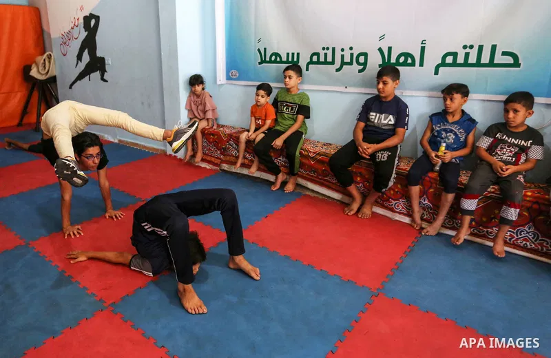Palestinian boys perform yoga on International Yoga Day amid the coronavirus disease (COVID-19) crisis in a club in Gaza City June 25, 2020. Photo by Ashraf Amra