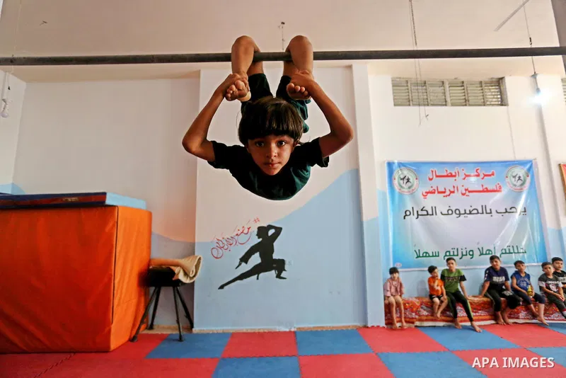 Palestinian boys perform yoga on International Yoga Day amid the coronavirus disease (COVID-19) crisis in a club in Gaza City June 25, 2020. Photo by Ashraf Amra