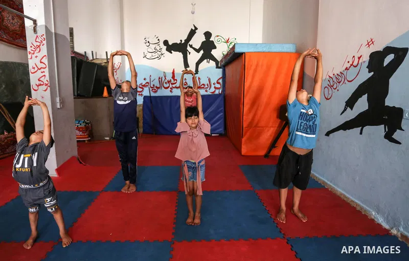 Palestinian boys perform yoga on International Yoga Day amid the coronavirus disease (COVID-19) crisis in a club in Gaza City June 25, 2020. Photo by Ashraf Amra
