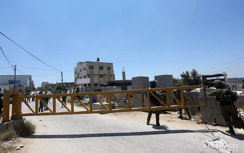 Israeli security forces stands guard during a protest against Israel's plan to annex parts of the occupied West Bank, in the Palestinian village of Haris, southwest of Nablus, on June 26, 2020. Photo by Shadi Jarar'ah