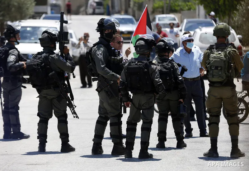 Palestinians argue with Israeli security forces during a protest against Israel's plan to annex parts of the occupied West Bank, in the Palestinian village of Haris, southwest of Nablus, on June 26, 2020. Photo by Shadi...