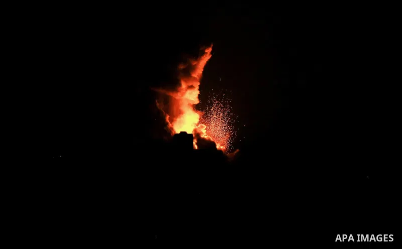 Flame and smoke are seen during an Israeli air strike, in Khan Younis in the southern Gaza Strip, on June 26, 2020. Photo by Ashraf Amra