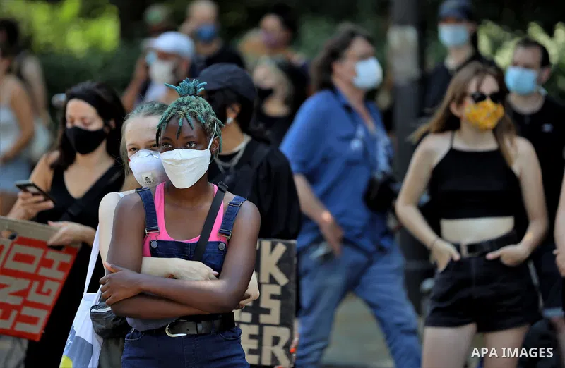 People gather take part in a protest against racial inequality, in Berlin, Germany, on June 27, 2020. Photo by Manar Shahin
