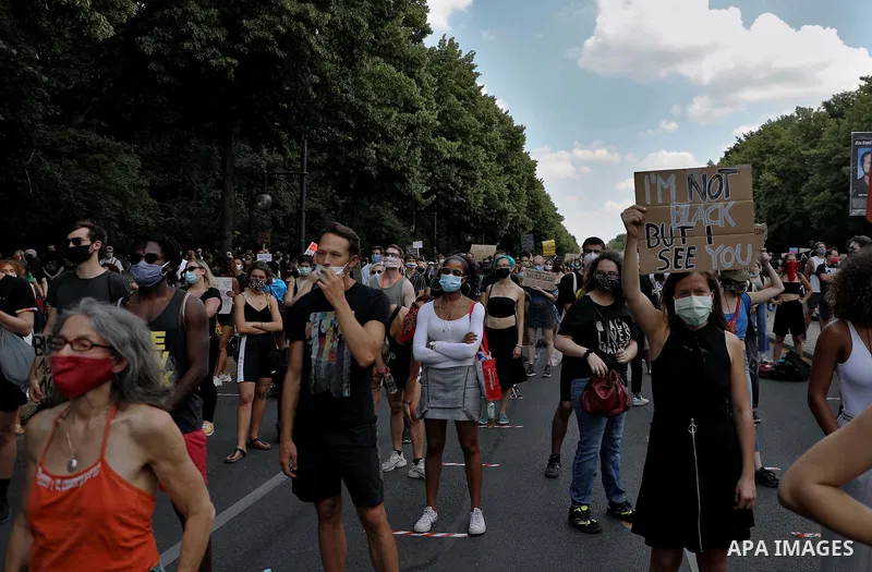 People gather take part in a protest against racial inequality, in Berlin, Germany, on June 27, 2020. Photo by Manar Shahin