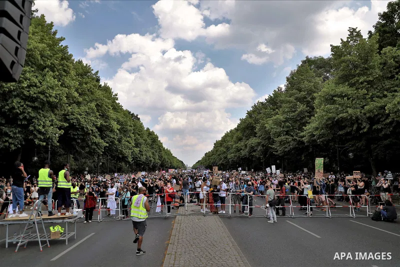 People gather take part in a protest against racial inequality, in Berlin, Germany, on June 27, 2020. Photo by Manar Shahin