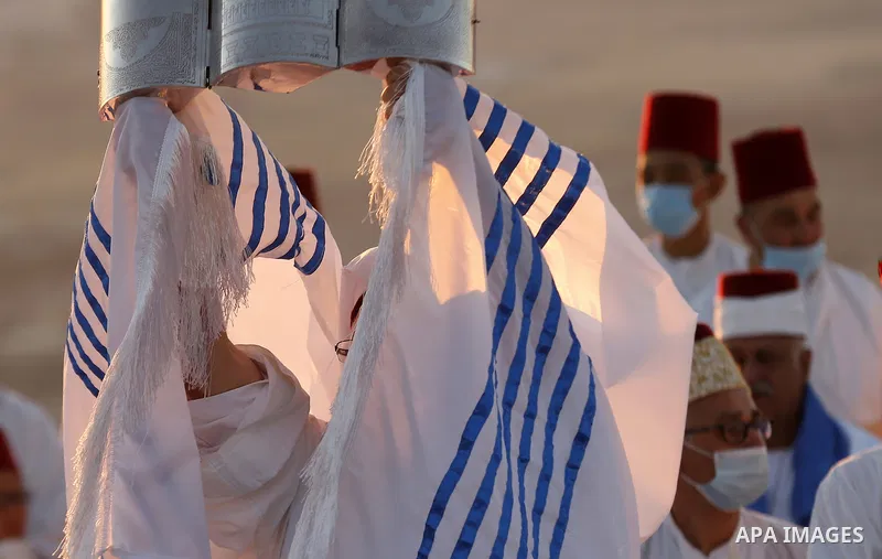 Samaritans gather to pray on top of Mount Gerizim near the northern West Bank city of Nablus as they celebrate the Shavuot festival at dawn, on June 28, 2020. Shavuot marks the giving of the Torah at Mount Sinai seven we...