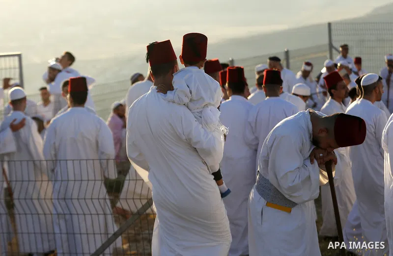 Samaritans gather to pray on top of Mount Gerizim near the northern West Bank city of Nablus as they celebrate the Shavuot festival at dawn, on June 28, 2020. Shavuot marks the giving of the Torah at Mount Sinai seven we...