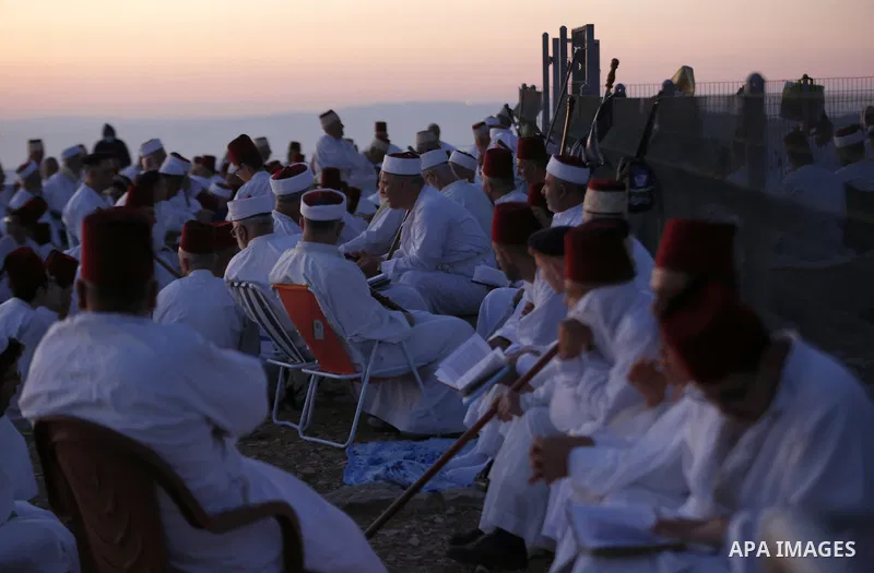 Samaritans gather to pray on top of Mount Gerizim near the northern West Bank city of Nablus as they celebrate the Shavuot festival at dawn, on June 28, 2020. Shavuot marks the giving of the Torah at Mount Sinai seven we...