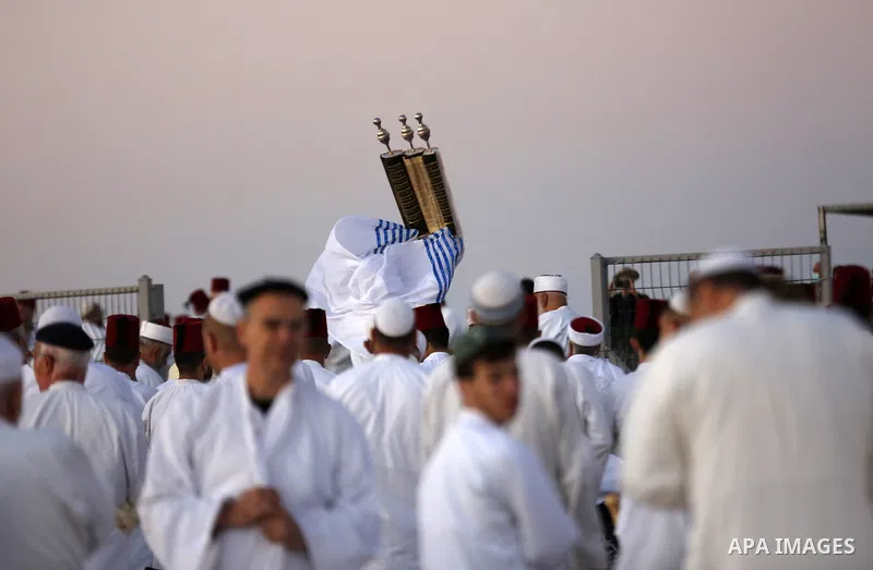 Samaritans gather to pray on top of Mount Gerizim near the northern West Bank city of Nablus as they celebrate the Shavuot festival at dawn, on June 28, 2020. Shavuot marks the giving of the Torah at Mount Sinai seven we...