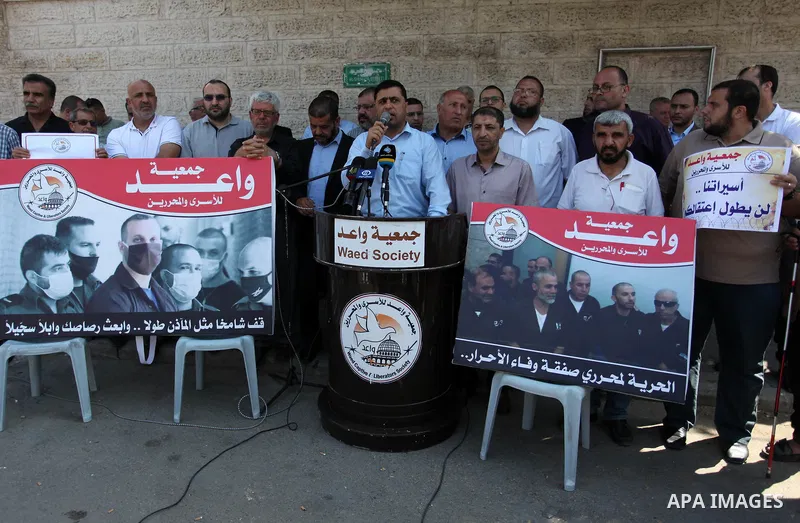 Palestinians take part in a protest in solidarity with prisoners in Israeli jails, in front of the Red cross office, in Gaza city on June 29, 2020. Photo by Mahmoud Ajjour