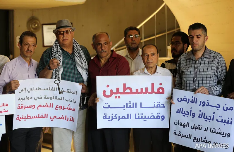 Palestinians take part in a protest against Israel's plan to annex parts of the occupied territory and against US President Donald Trump's Century Deal "expected peace plan", in Gaza city, on June 29, 2020. Photo by Ashr...