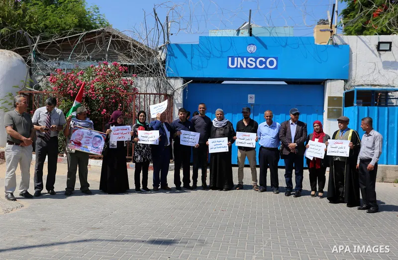 Palestinians take part in a protest against Israel's plan to annex parts of the occupied territory and against US President Donald Trump's Century Deal "expected peace plan", in front of the headquarter United Nation "UN...