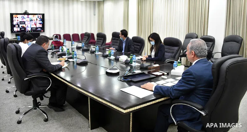 Palestinian Prime Minister Mohammad Ishtayeh, meets with British parliamentarians via a video link, in the West Bank city of Ramallah, on June 29, 2020. Photo by Prime Minister Office