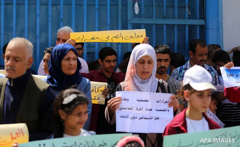 Palestinians formerly employed by United Nations Relief and Works Agency (UNRWA) take part in a protest demanding their rights, outside its headquarter office, in Gaza City on June 30, 2020. Photo by Mahmoud Nasser