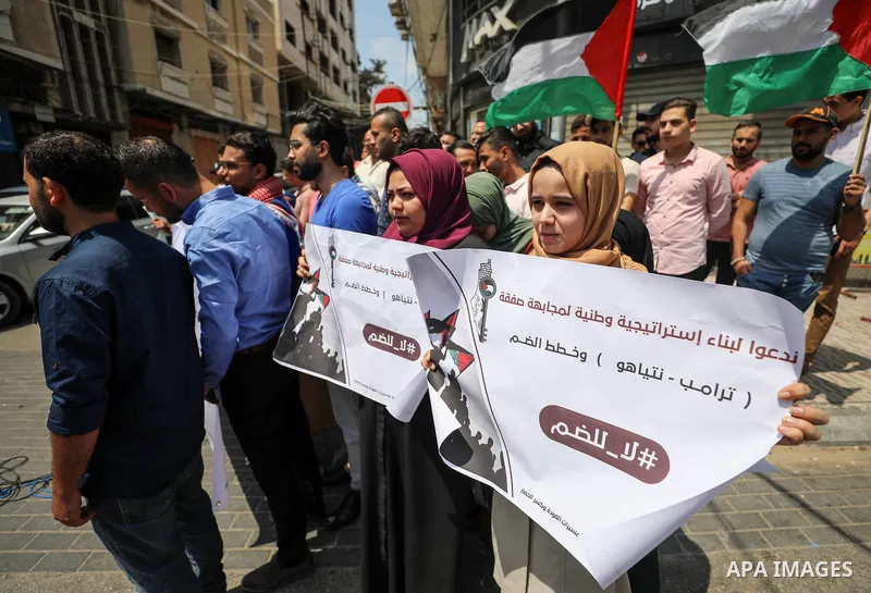 Palestinian protesters take part in a protest against Israel's plans to annex parts of the occupied West Bank, in Gaza city, on June 30, 2020. Israel aims to begin a process of annexing West Bank settlements and the Jord...
