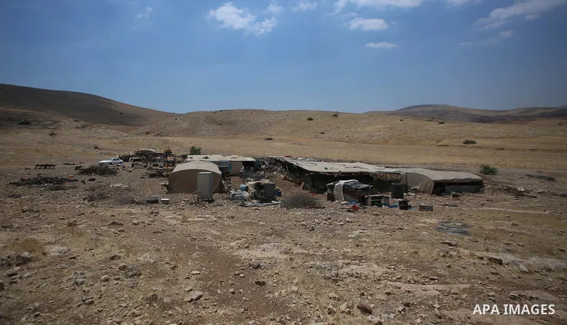 Palestinian girl Bisan Kaabneh,10, graze sheep near their tents in Khirbet Samra in the northern Jordan Valley, lands threatened with confiscation within Israel's plans to annex parts of the occupied West Bank, on June 3...