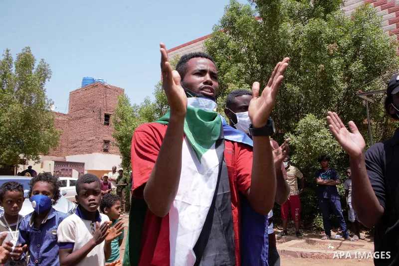 Sudanese protesters chant during a protest on Sixty street in the east of the capital Khartoum, on June 30, 2020. Tens of thousands of Sudanese took to the streets in several cities and the capital calling for reforms an...