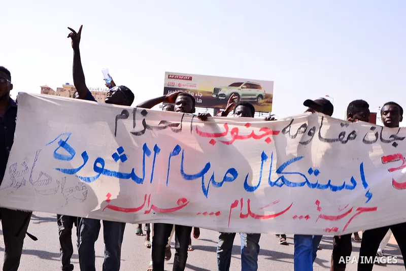Sudanese protesters chant during a protest on Sixty street in the east of the capital Khartoum, on June 30, 2020. Tens of thousands of Sudanese took to the streets in several cities and the capital calling for reforms an...