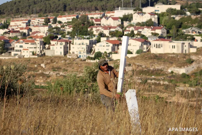 Palestinian workers work near the Israeli settlement of Efrat within the Gush Etzion settlement between Hebron and Bethlehem in the West Bank on June 30, 2020. Israel aims to begin a process of annexing West Bank settlem...