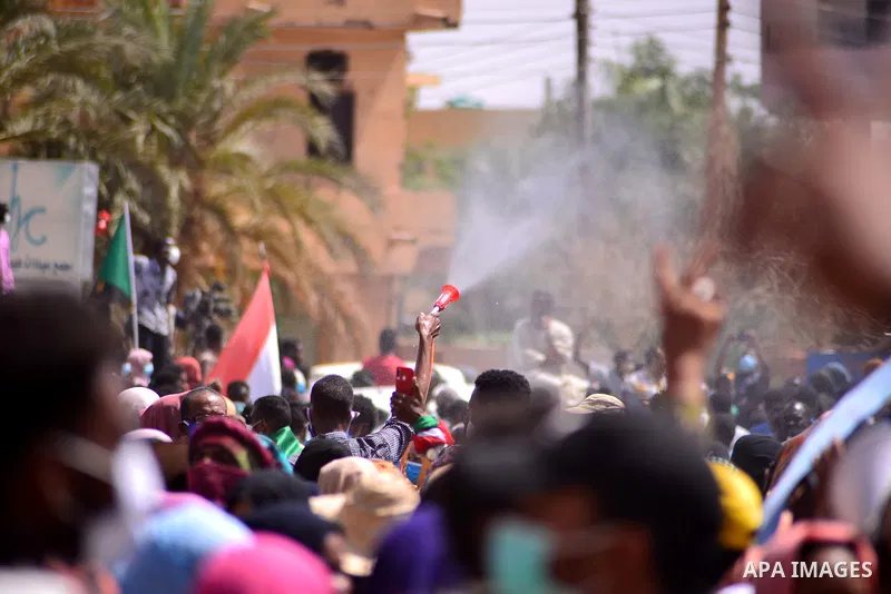 Sudanese protesters chant during a protest on Sixty street in the east of the capital Khartoum, on June 30, 2020. Tens of thousands of Sudanese took to the streets in several cities and the capital calling for reforms an...