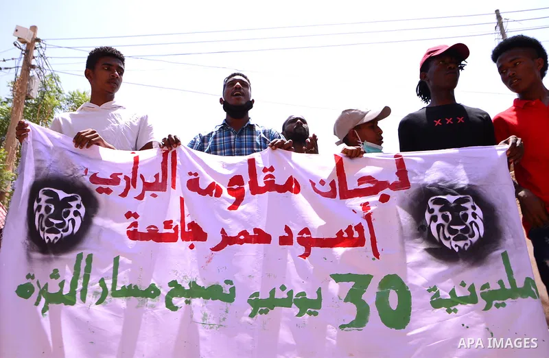Sudanese protesters chant during a protest on Sixty street in the east of the capital Khartoum, on June 30, 2020. Tens of thousands of Sudanese took to the streets in several cities and the capital calling for reforms an...