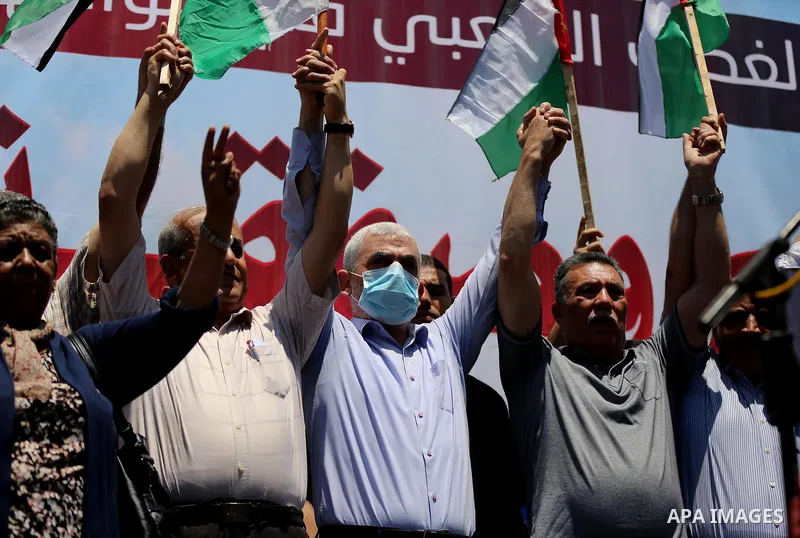 Hamas leader in the Gaza Strip Yahya Sinwar, wearing protective face mask attends a demonstration against Israel's West Bank annexation plans in Gaza City on July 1, 2020. Israel's Prime Minister Benjamin Netanyahu, embo...