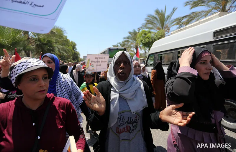 Palestinians hold placards and national flags during a demonstration against Israel's West Bank annexation plans in Gaza City on July 1, 2020. Israel's Prime Minister Benjamin Netanyahu, emboldened by the US Mideast plan...