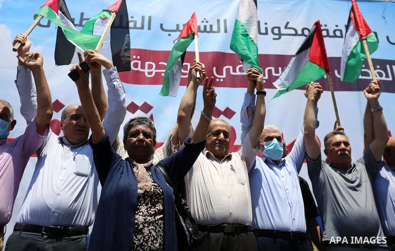Hamas leader in the Gaza Strip Yahya Sinwar, wearing protective face mask attends a demonstration against Israel's West Bank annexation plans in Gaza City on July 1, 2020. Israel's Prime Minister Benjamin Netanyahu, embo...