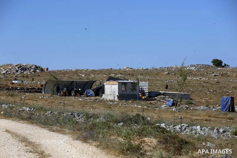 An Israeli settler puts caravans, at the Asira town north the West Bank city of Nablus on, on July 1, 2020. Under the pretext of controlling the lands near Joshua bin Nun. Joshua ben nun, of the tribe of ephraim, was the...