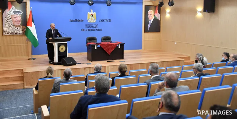 Palestinian Prime Minister Mohammed Ishtayeh, attends signe of a memorandum to complete the preparation of the national spatial development plan, in the West Bank city of Ramallah on July 1, 2020. Photo by Prime Minister...