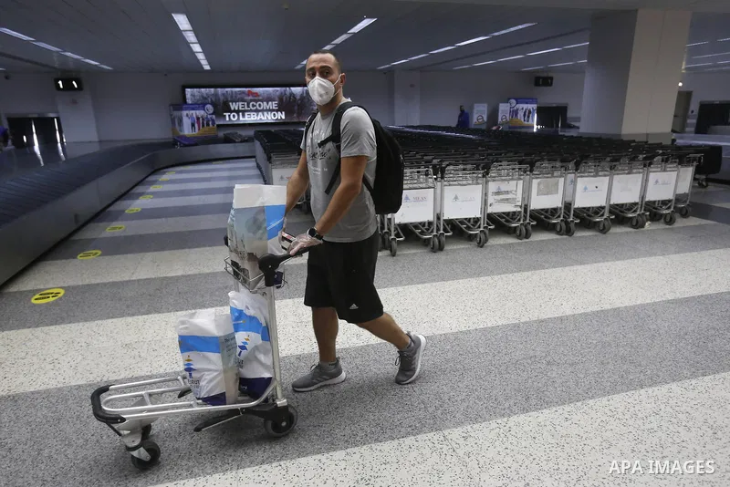 Lebanese travelers arrive at Beirut international airport after its re-opening in Beirut, Lebanon, 01 July 2020. Beirut's airport is partially reopening after a three-month shutdown and Lebanon's cash-strapped government...