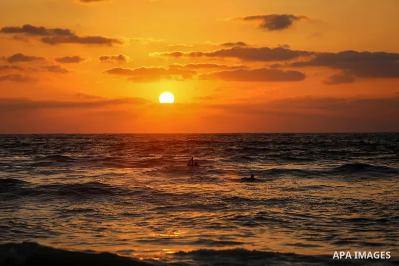 Palestinians enjoy at the beach a sunny summer day in Gaza city on July 17, 2020. Photo by Ashraf Amra