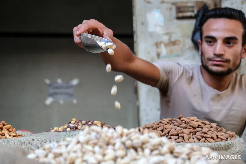 Palestinian shop at a market ahead of Eid al-Adha festival, in Gaza city, on July 30, 2020. Muslims across the world are preparing for the Eid al-Adha holiday when custom requires the faithful to make a sacrifice. Photo...