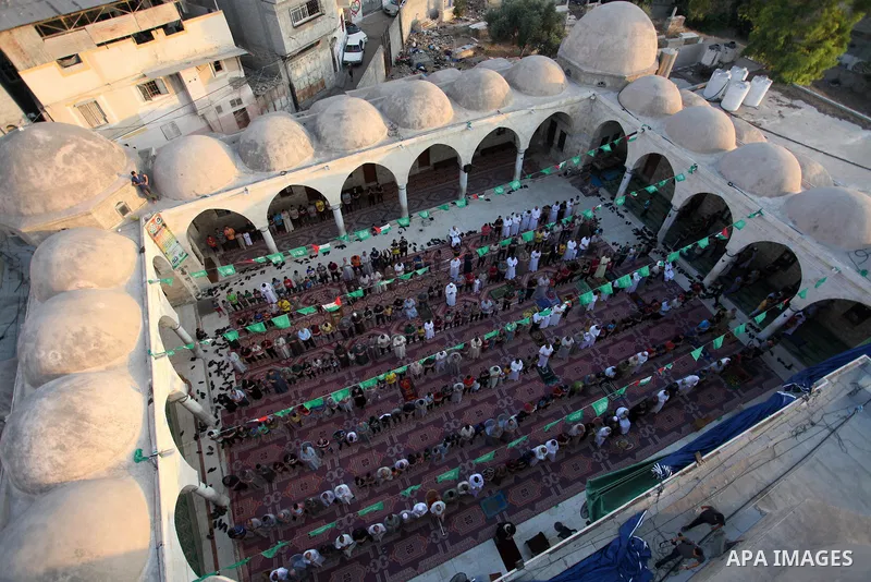 Palestinian muslims attend the prayer of Eid al-Adha or the feast of sacrifice in Gaza city, on July 31, 2020. Muslims around the world are celebrating Eid al-Adha, the "Feast of Sacrifice", which marks the end of the an...