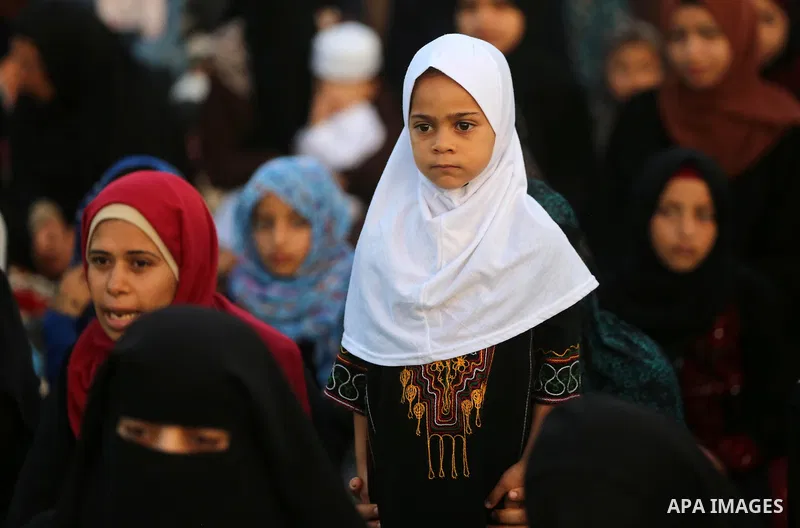 Palestinian muslims attend the prayer of Eid al-Adha or feast of the sacrifice, in khan Younis in the southern of Gaza strip on July 31, 2020. Muslims are celebrating Eid al-Adha (the feast of sacrifice), the second of t...