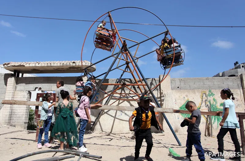 Palestinian children celebrate on the first day of Eid al-Adha or feast of the sacrifice, in Gaza city on July 31, 2020. Muslims are celebrating Eid al-Adha (the feast of sacrifice), the second of two Islamic holidays ce...