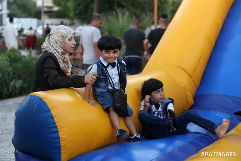 Palestinian children celebrate during the Eid al-Adha holiday or feast of the sacrifice, in Gaza city on August 2, 2020. Muslims are celebrating Eid al-Adha (the feast of sacrifice), the second of two Islamic holidays ce...