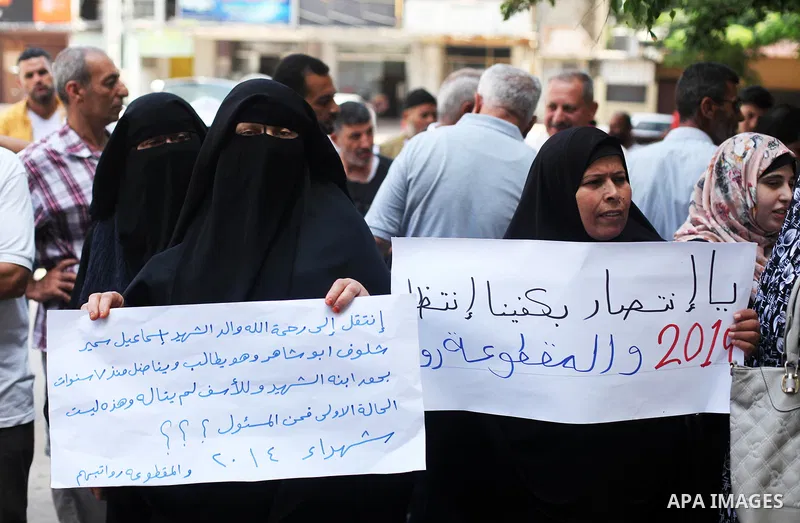 Palestinian families of martyrs and woundeds take part a protest to demand their rights and salaries, in Gaza city, on August 4, 2020. Photo by Mahmoud Ajjour