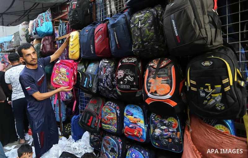 Palestinians shop during preparation for the new school year at a market in Khan Younis southern of Gaza strip, on August 4, 2020. Photo by Ashraf Amra