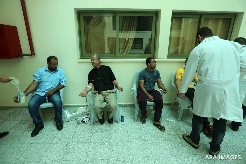 Palestinians take part in a blood donation event in solidarity with the injured of the explosion in Lebanon, in Khan Younis in the southern Gaza Strip, on August 5, 2020. According to media reports, at least 100 people w...