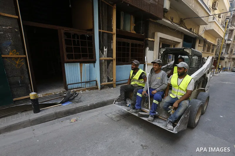 Lebanese workers clear debris near the site of blast in Beirut's port area, Lebanon on August 9, 2020, in the aftermath of a colossal explosion that occurred days prior due to a huge pile of ammonium nitrate that had lan...